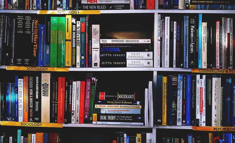 Close-up of a library shelf with books on internet and technology. Ideal for education-themed projects.