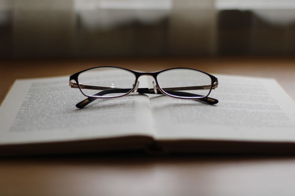 Detailed shot of an open book emphasizing printed text and paper texture.